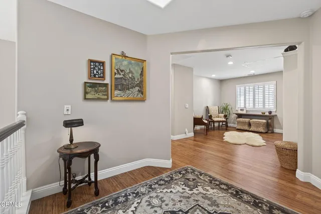 a couple of potted plants and bench in front of door