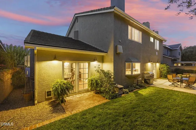 a view of backyard with furniture and outdoor seating
