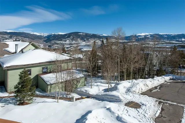 a view of a town with mountains in the background