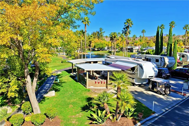 a view of a patio with table and chairs potted plants