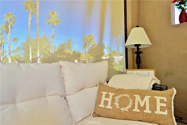 a living room with a bed and a table