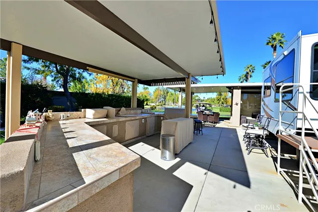 a view of a living room with furniture and flat screen tv