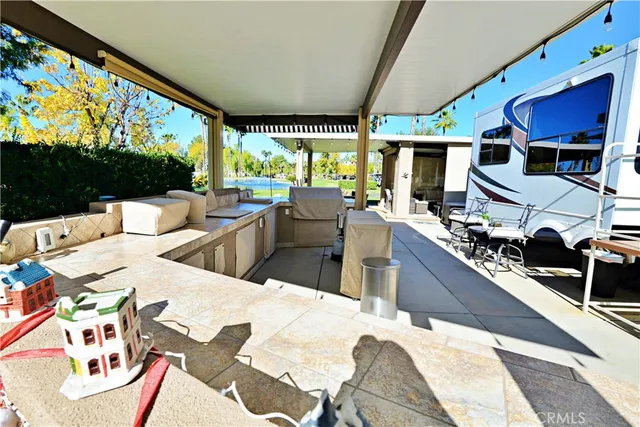 a large kitchen with a table and chairs