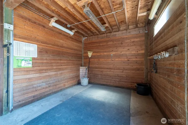 a view of a garage with wooden wall