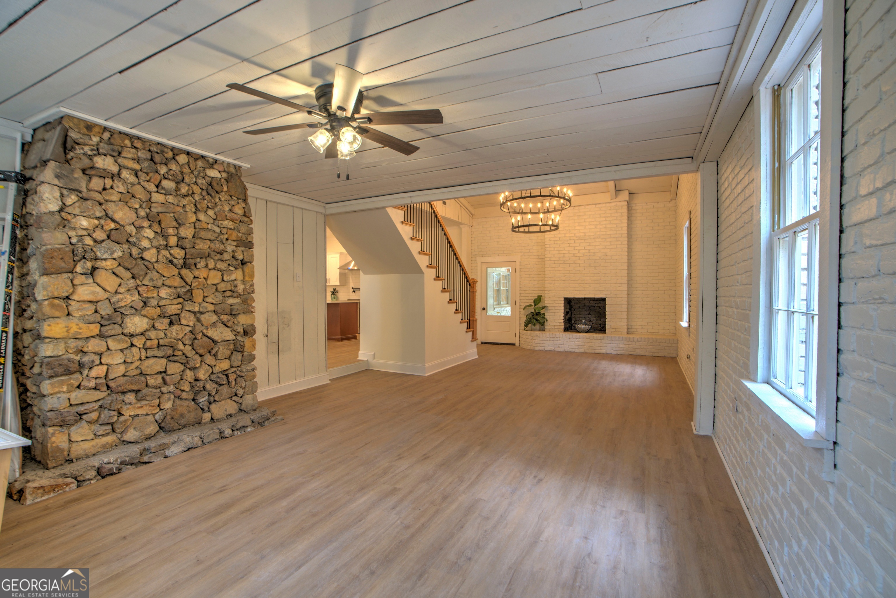 205 Mt Alto Road Southwest Rome, GA 30165 - Photo 12 of 36 a view of empty room with wooden floor and fan