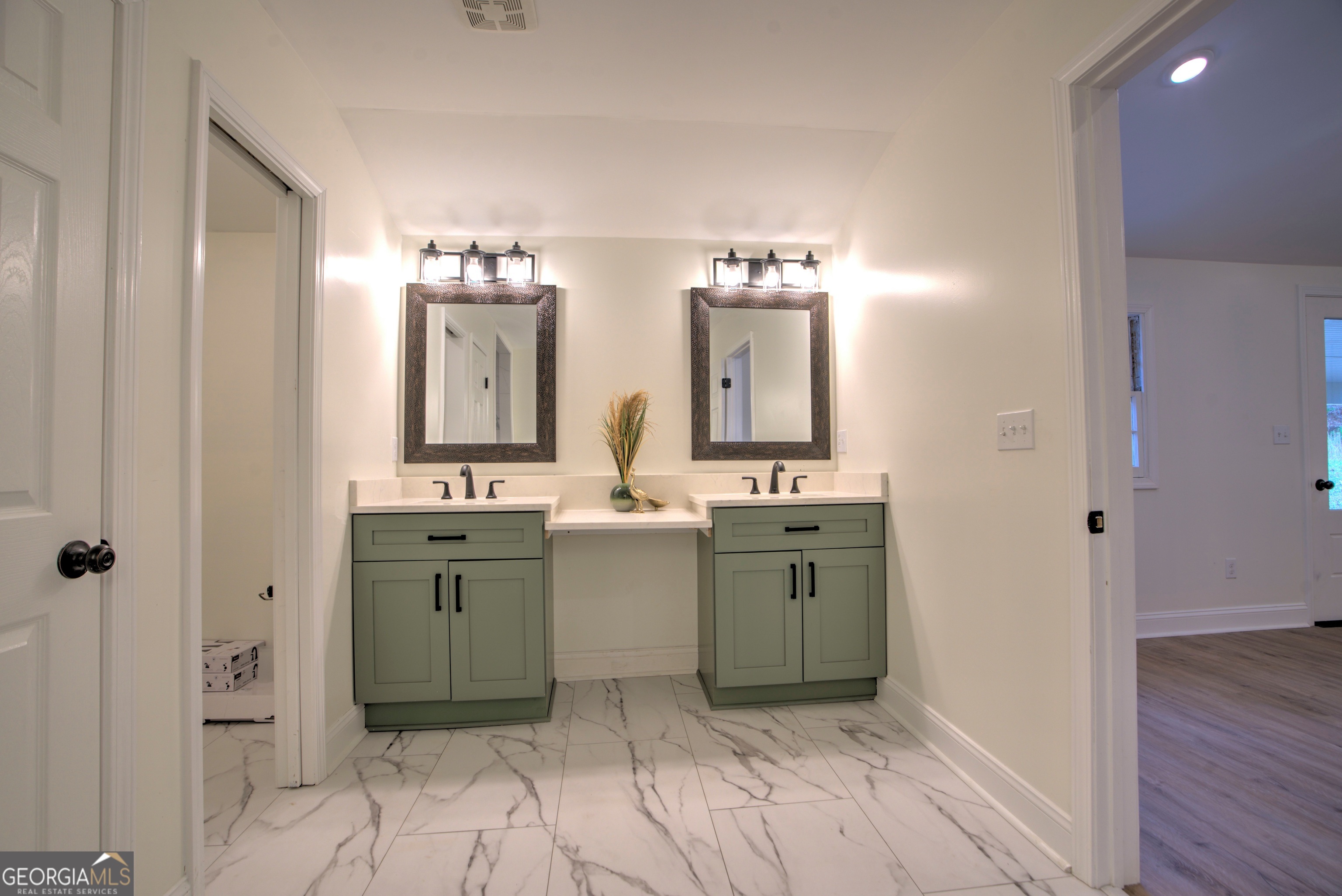 205 Mt Alto Road Southwest Rome, GA 30165 - Photo 16 of 36 a spacious bathroom with a double vanity sink and a mirror
