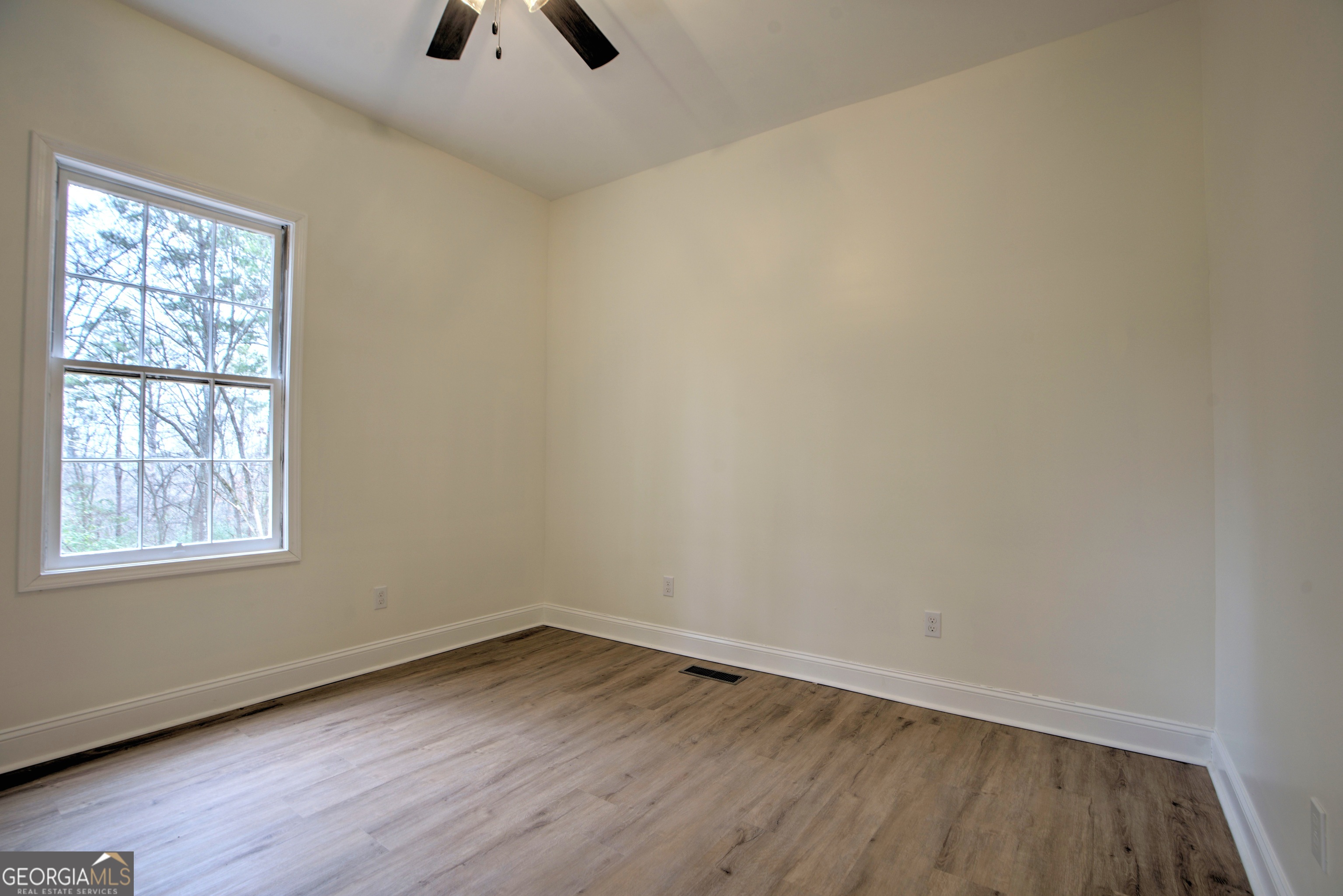 205 Mt Alto Road Southwest Rome, GA 30165 - Photo 19 of 36 an empty room with wooden floor and windows