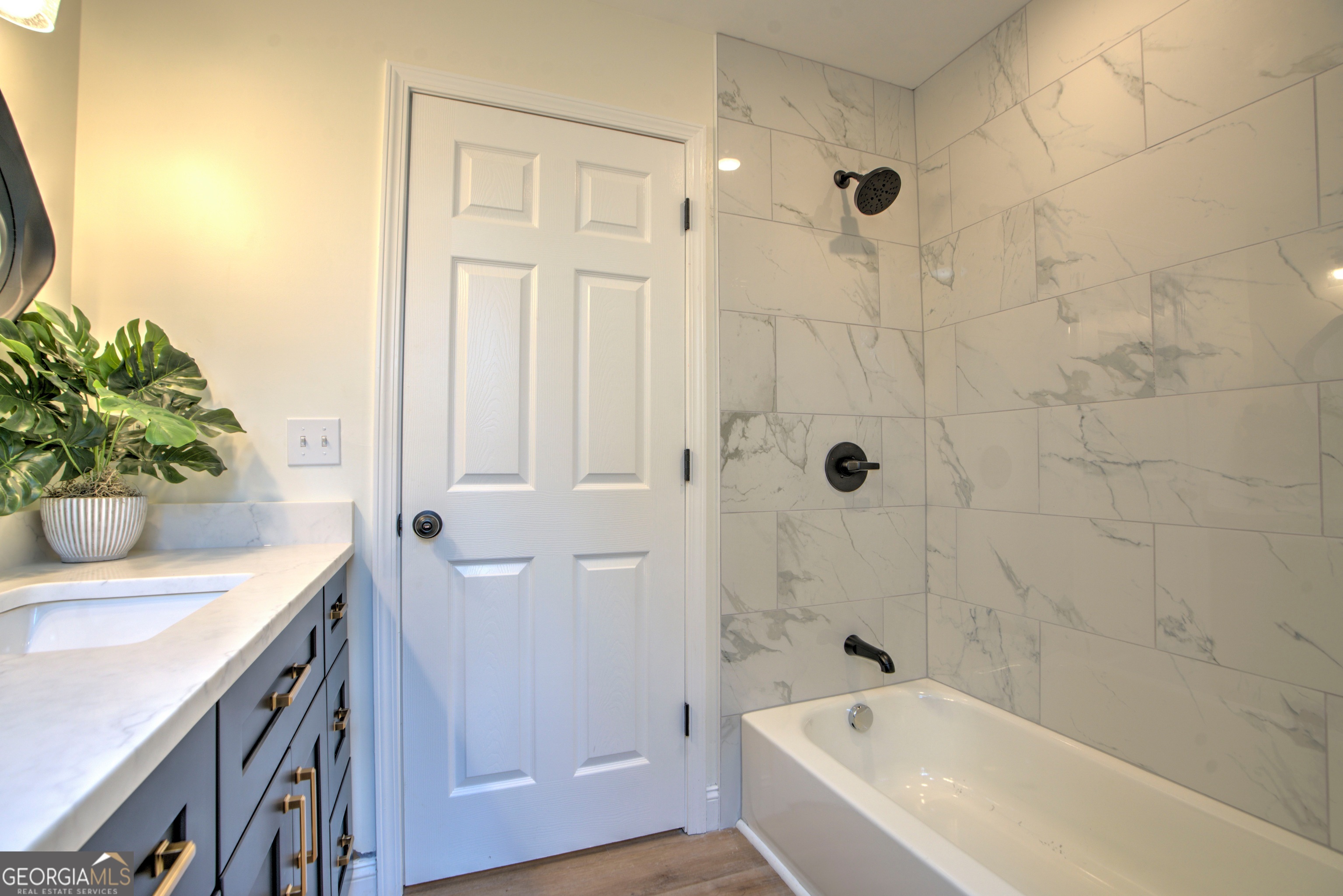 205 Mt Alto Road Southwest Rome, GA 30165 - Photo 23 of 36 a bathroom with a granite countertop sink a toilet a shower and bathtub