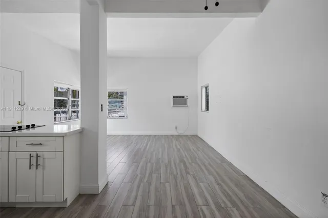 a view of kitchen with wooden floor