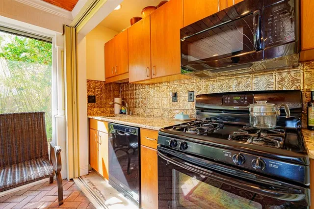 a bathroom with a toilet and shower