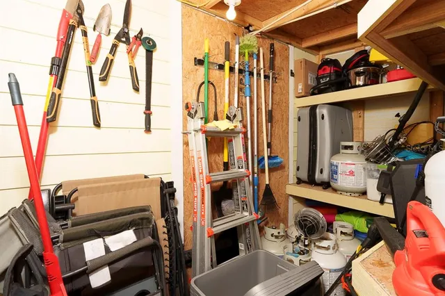 a utility room with dryer washer and a view of living room