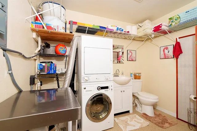 a view of a patio with a table and chairs next to a yard