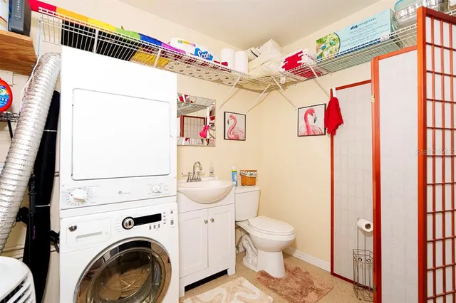 a view of living room with furniture and kitchen view