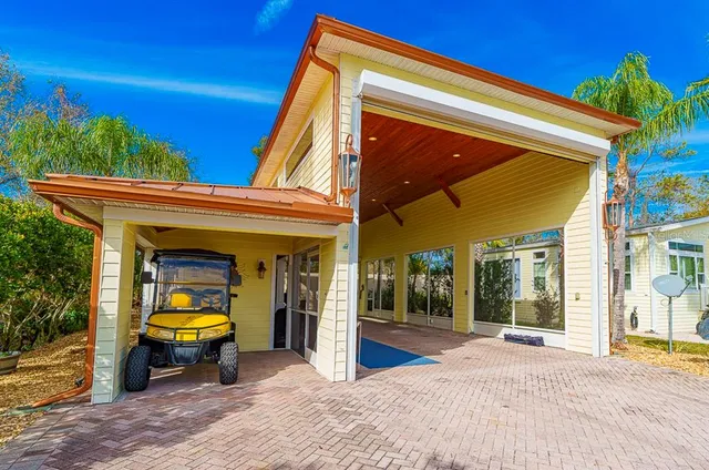 an aerial view of a pool patio chairs and fire pit