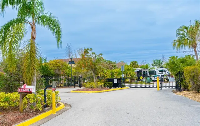 an aerial view of a house with swimming pool and outdoor seating