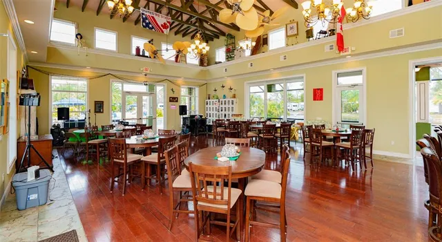 a view of swimming pool with a table and chairs