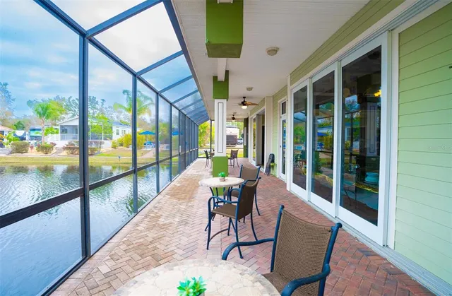 a backyard of a house with table and chairs