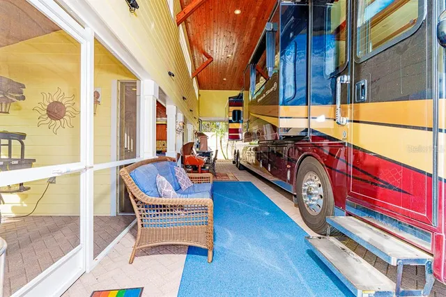 a outdoor space with patio the couches and a dining table with garden view