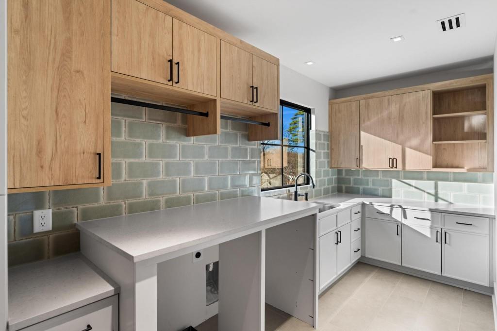 843 Yorkshire Road Northeast Atlanta, GA 30306 - Photo 29 of 65 a kitchen with stainless steel appliances a sink stove and cabinets