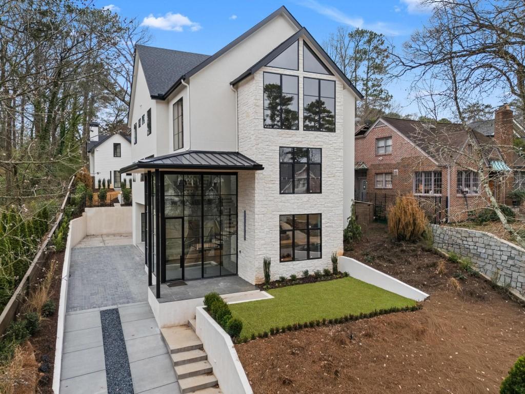 843 Yorkshire Road Northeast Atlanta, GA 30306 - Photo 53 of 65 a front view of a house with a yard