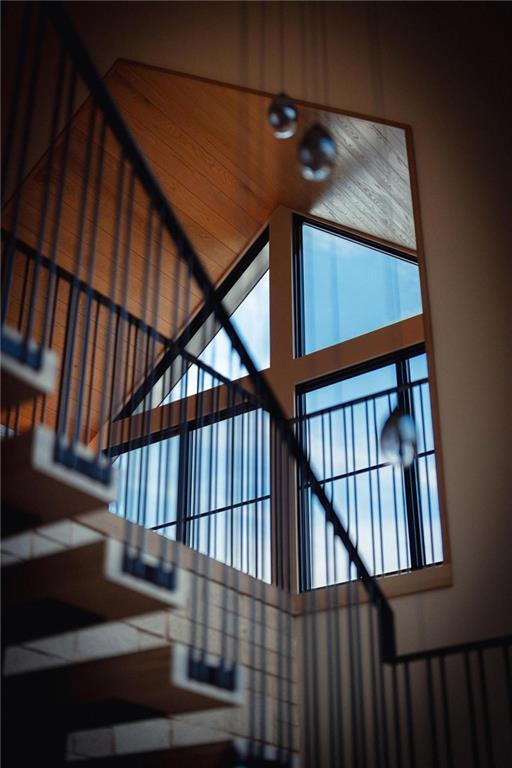 843 Yorkshire Road Northeast Atlanta, GA 30306 - Photo 64 of 65 a view of staircase with lots of frames on wall and a window