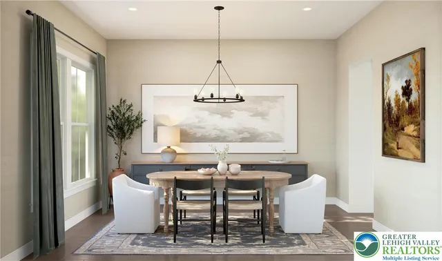 a dining room with table and chairs