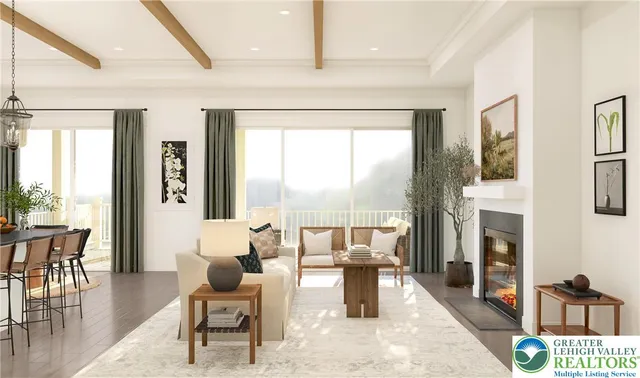 a living room with fireplace furniture and a large window