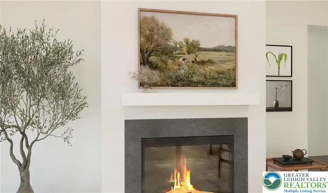 a view of a fireplace with a painting on the wall