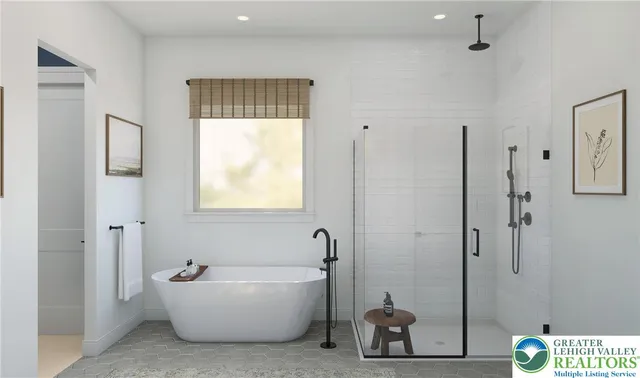 a bathroom with a bathtub and shower