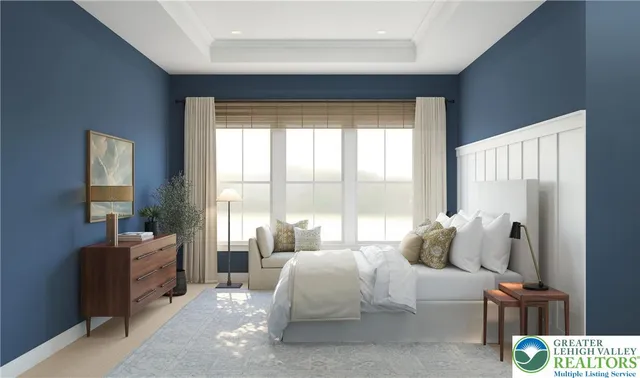 a spacious bedroom with a bed and a couch