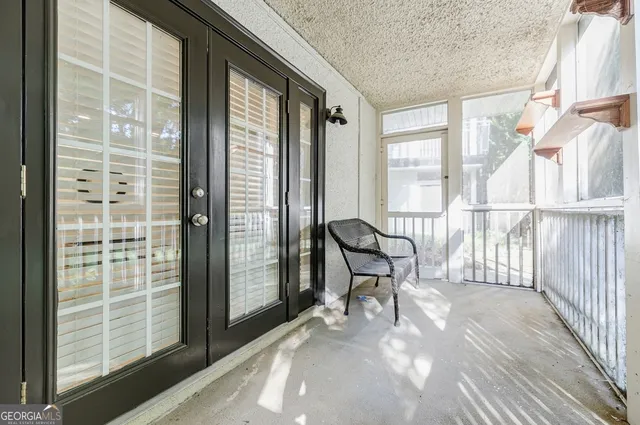 a view of a room with wooden floor and chair