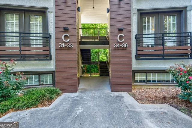 a view of a brick house with a large windows