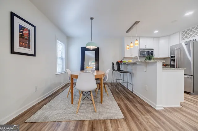 a dining room with furniture and window