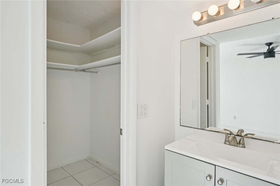 1006 Southeast 46th Street, Unit 1C Cape Coral, FL 33904 - Photo 11 of 26 a bathroom with a sink and a mirror