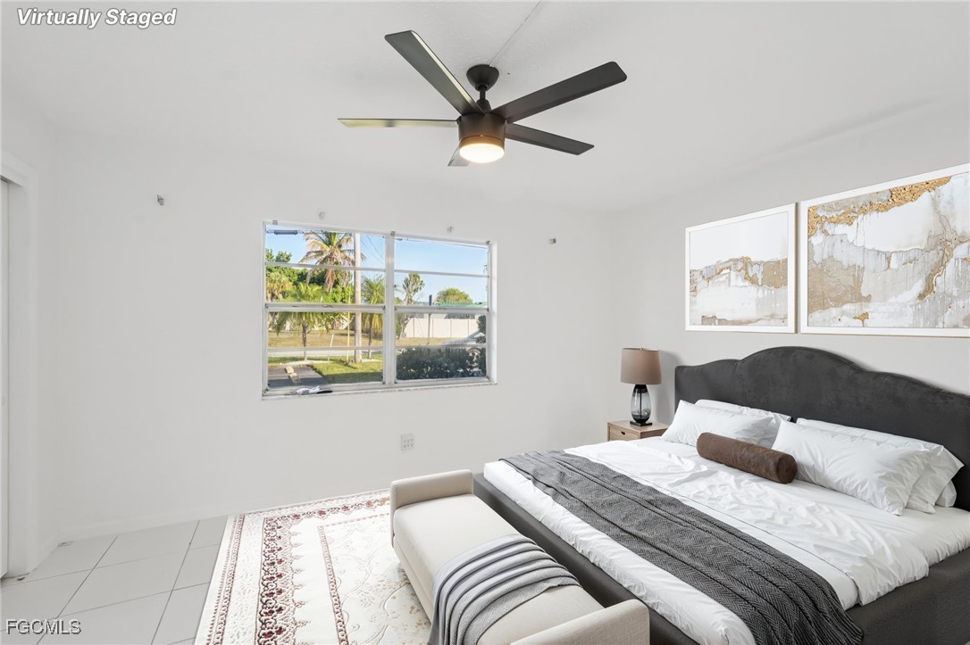 1006 Southeast 46th Street, Unit 1C Cape Coral, FL 33904 - Photo 12 of 26 a bedroom with a bed and a window