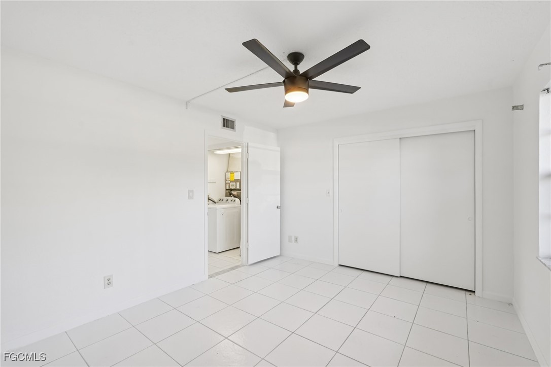 1006 Southeast 46th Street, Unit 1C Cape Coral, FL 33904 - Photo 14 of 26 a view of a livingroom with a ceiling fan and window