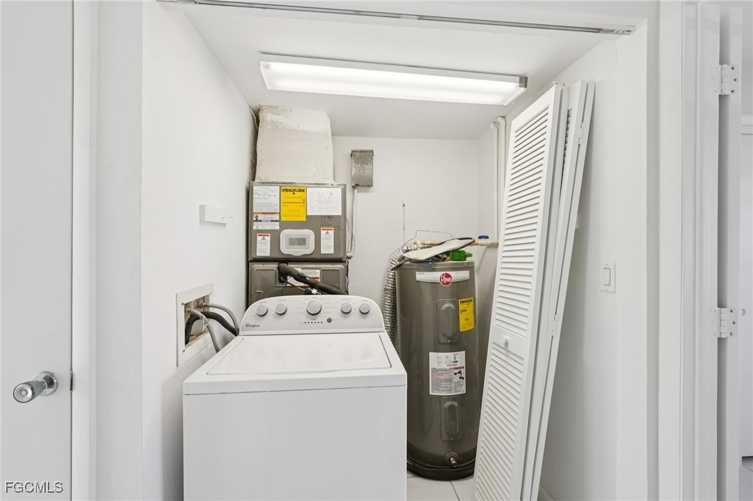 1006 Southeast 46th Street, Unit 1C Cape Coral, FL 33904 - Photo 16 of 26 a utility room with dryer and washer