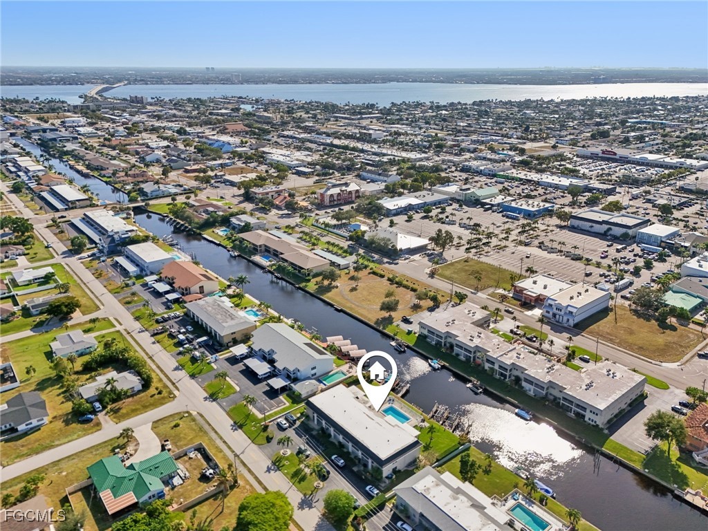 1006 Southeast 46th Street, Unit 1C Cape Coral, FL 33904 - Photo 23 of 26 an aerial view of a city with streets and houses