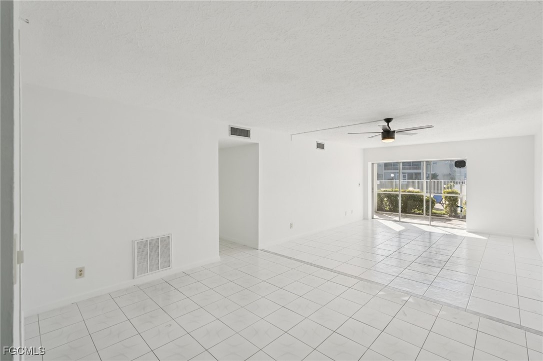 1006 Southeast 46th Street, Unit 1C Cape Coral, FL 33904 - Photo 3 of 26 an empty room with windows