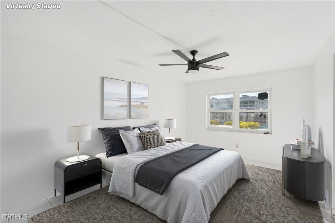 1006 Southeast 46th Street, Unit 1C Cape Coral, FL 33904 - Photo 7 of 26 a bedroom with a large bed and a window