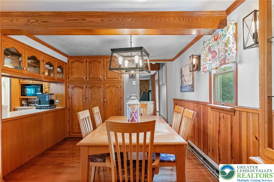 368 Meyer Road Nazareth, PA 18064 - Photo 17 of 66 a dining room with furniture a chandelier and wooden floor