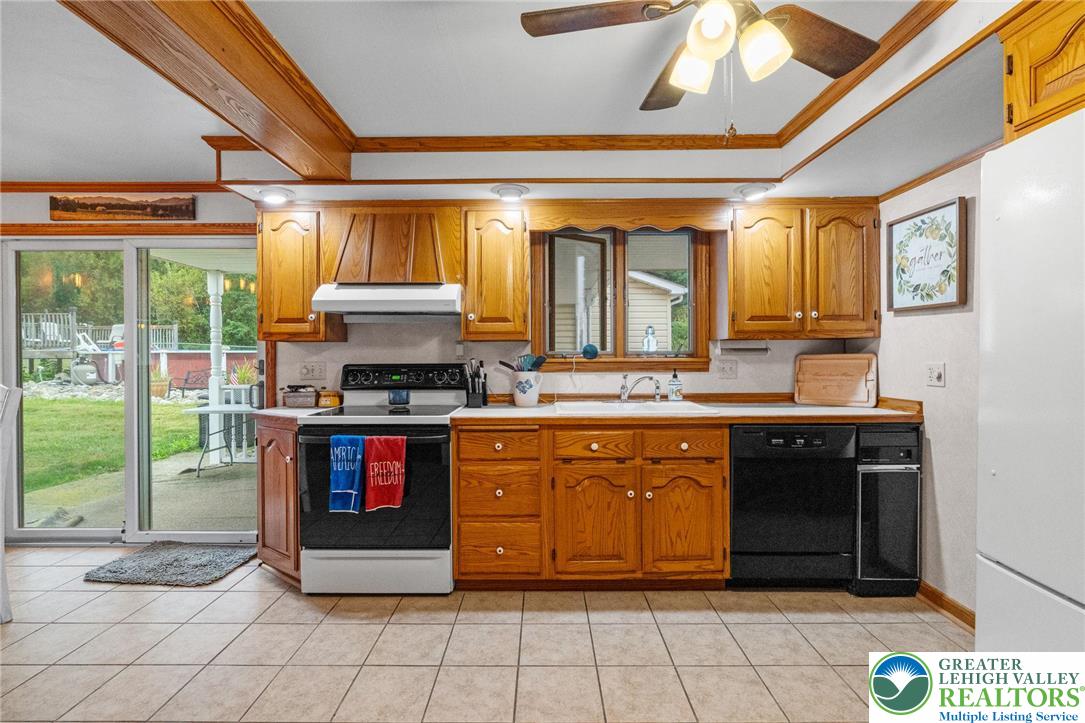 368 Meyer Road Nazareth, PA 18064 - Photo 23 of 66 a kitchen with stainless steel appliances granite countertop a stove a sink and a microwave