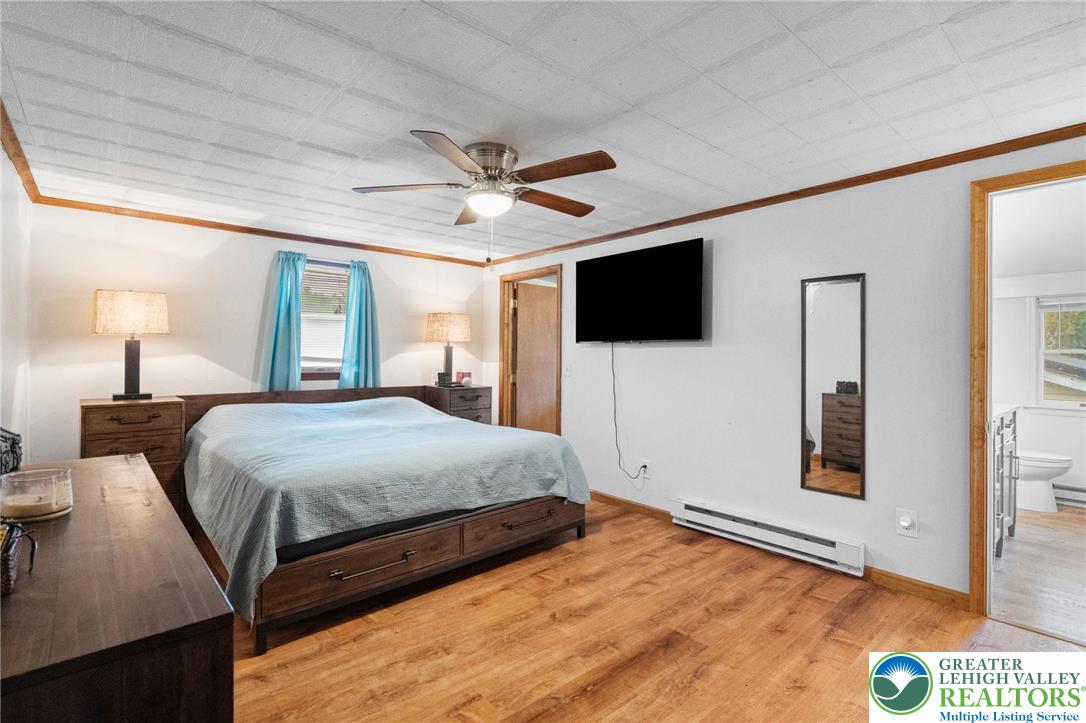368 Meyer Road Nazareth, PA 18064 - Photo 28 of 66 a bedroom with a bed and a flat screen tv