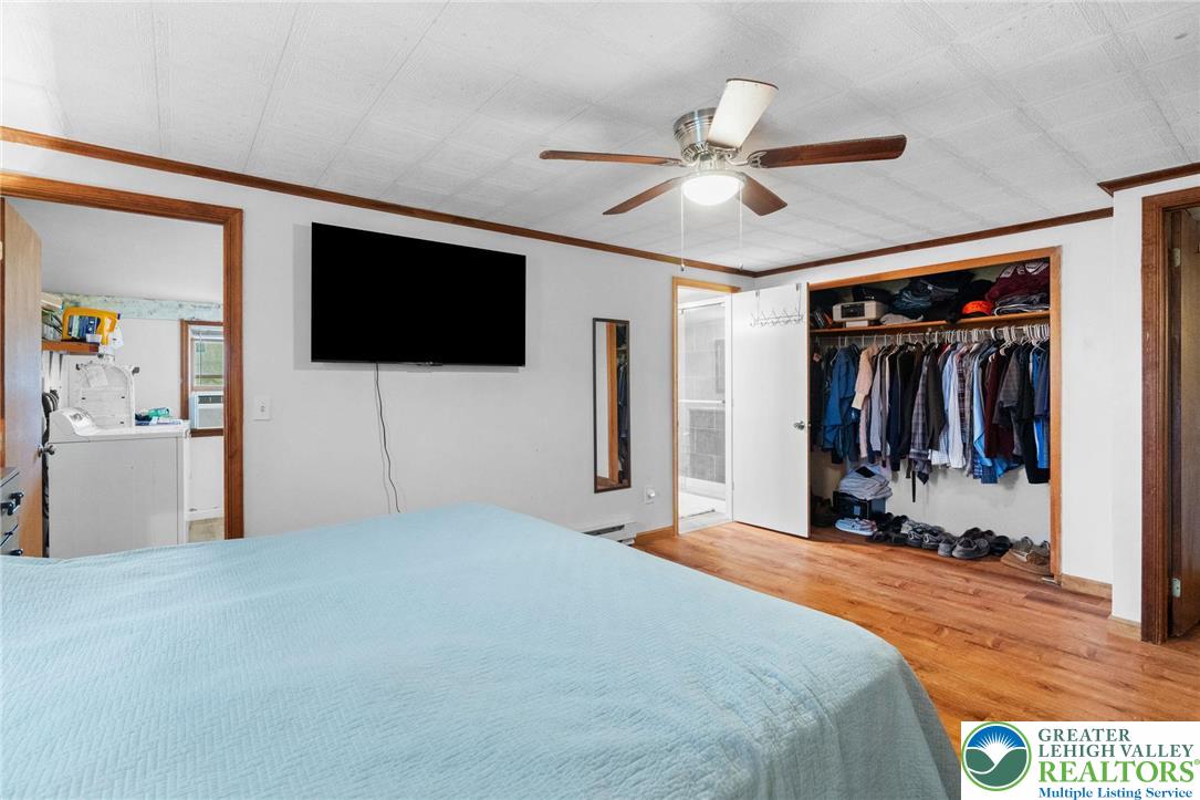 368 Meyer Road Nazareth, PA 18064 - Photo 30 of 66 a bedroom with a bed and a flat screen tv
