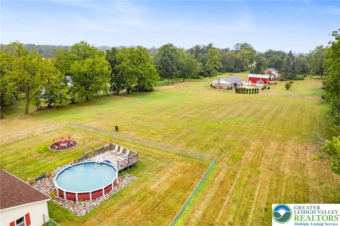 368 Meyer Road Nazareth, PA 18064 - Photo 58 of 66 a view of a swimming pool with an outdoor seating and a garden