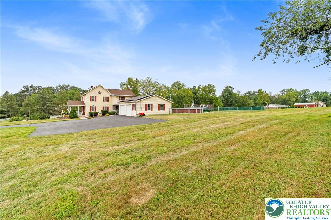368 Meyer Road Nazareth, PA 18064 - Photo 6 of 66 a view of a swimming pool with an outdoor seating and a garden