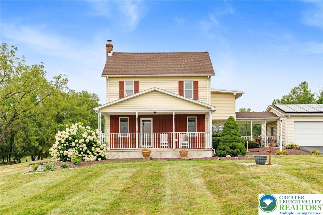 368 Meyer Road Nazareth, PA 18064 - Photo 7 of 66 a front view of a house with a garden and swimming pool