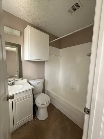 a bathroom with a toilet sink and a mirror