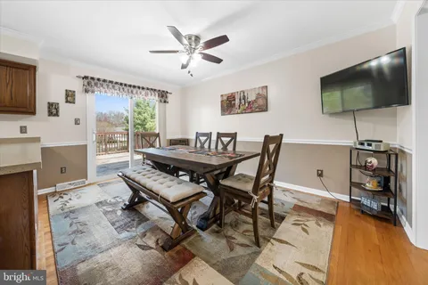 a view of a livingroom with furniture and a flat screen tv