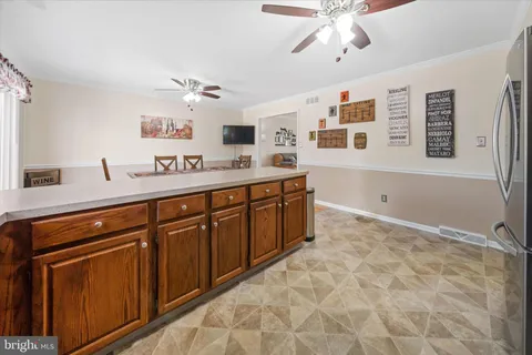 a spacious bathroom with a sink double vanity granite and a mirror